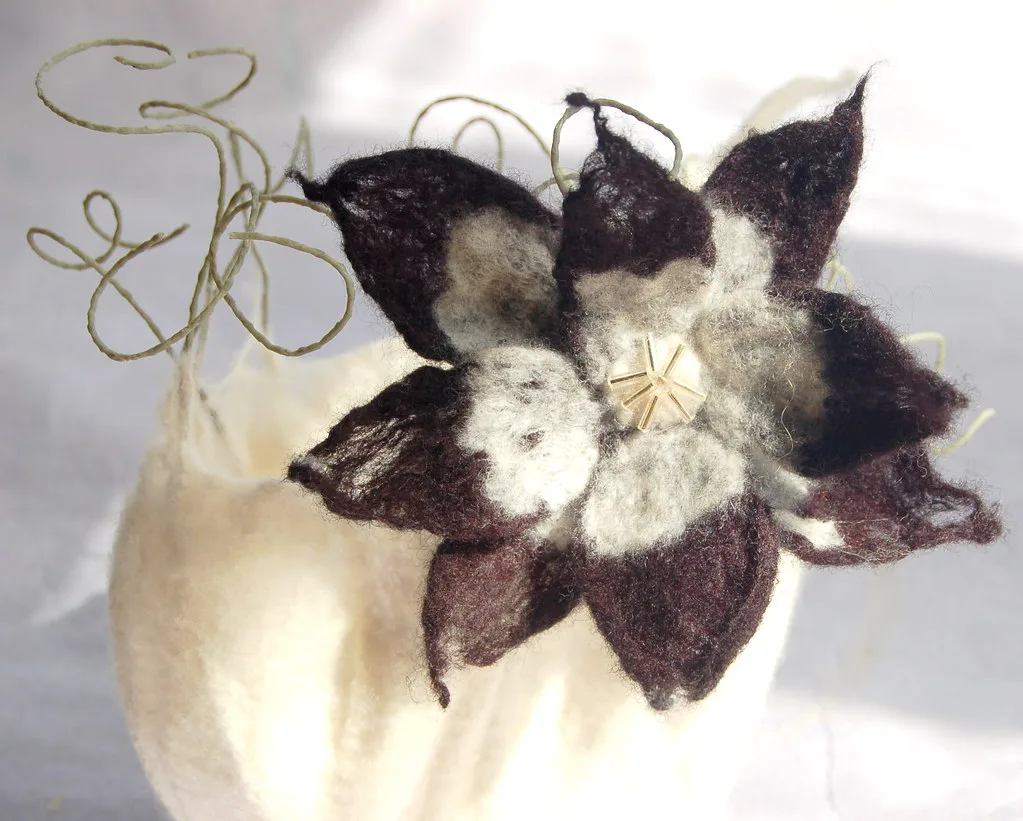 A felted flower hair clip