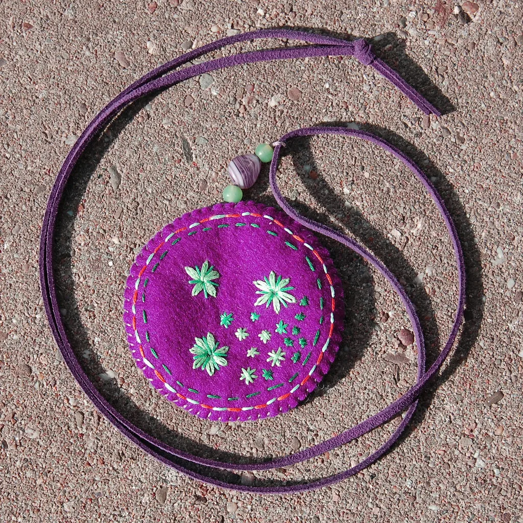 A small felted pendant, made the way a bag charm is