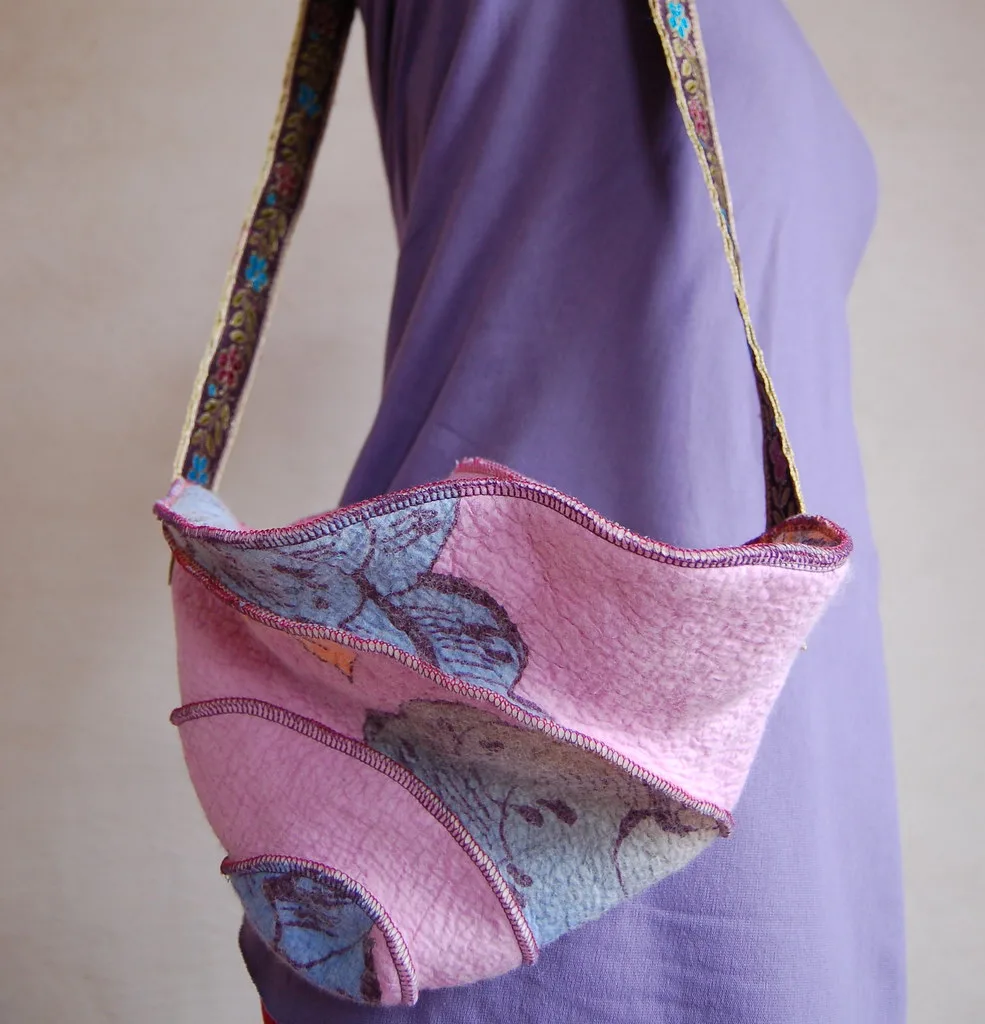 A handmade felted wool shoulder bag