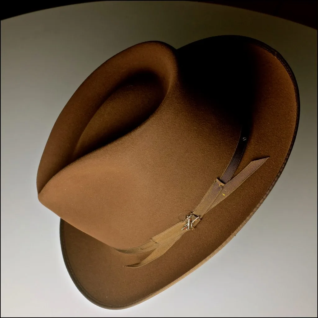 A felt hat with its grosgrain band and bow