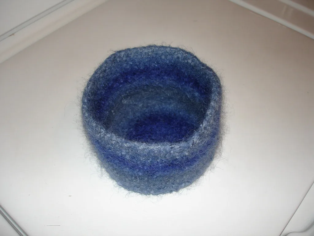 A knitted wool bowl after felting, the same construction as a cat cave