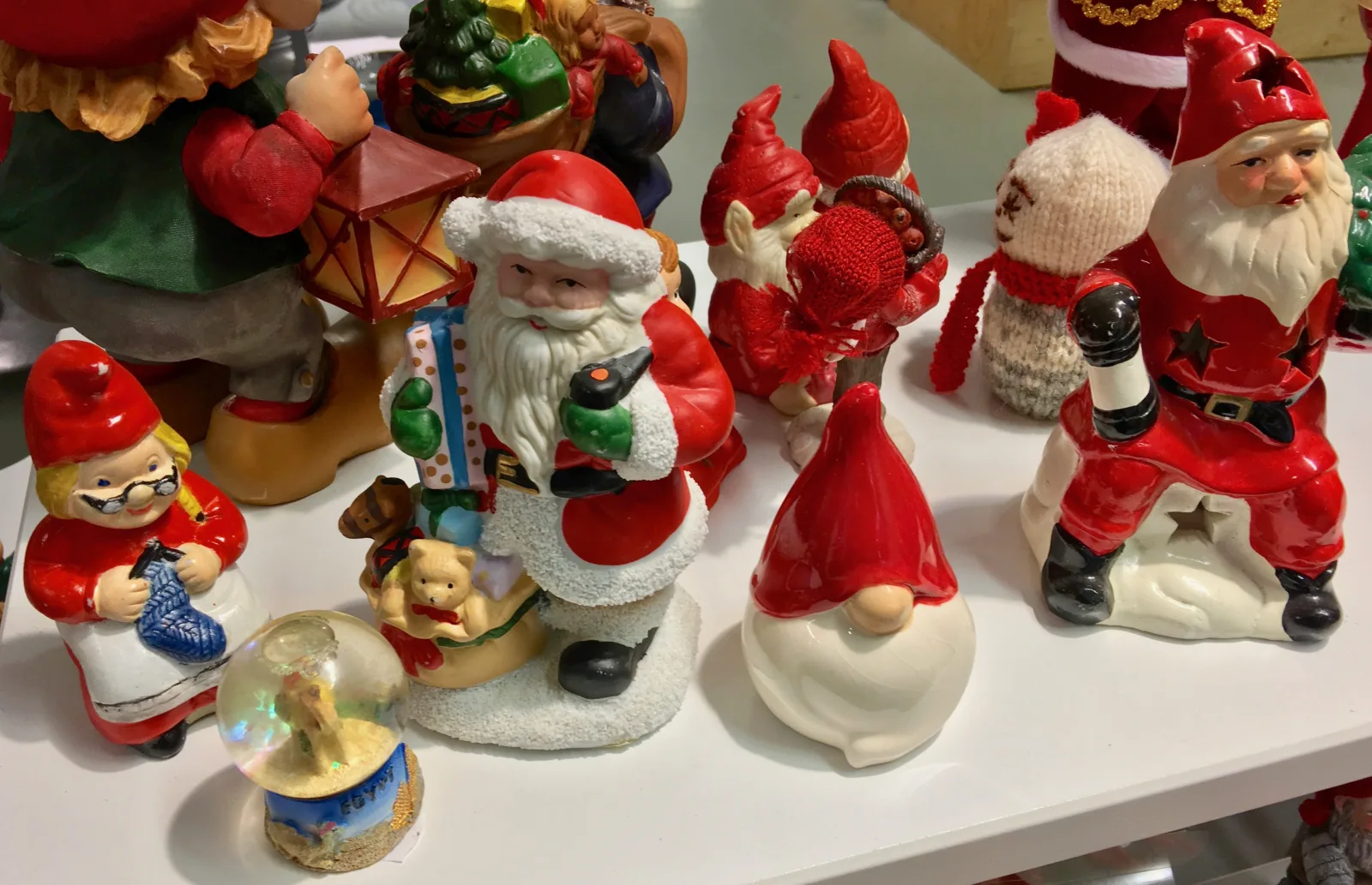 Scandinavian tomte figures, hats pulled down to leave only the nose