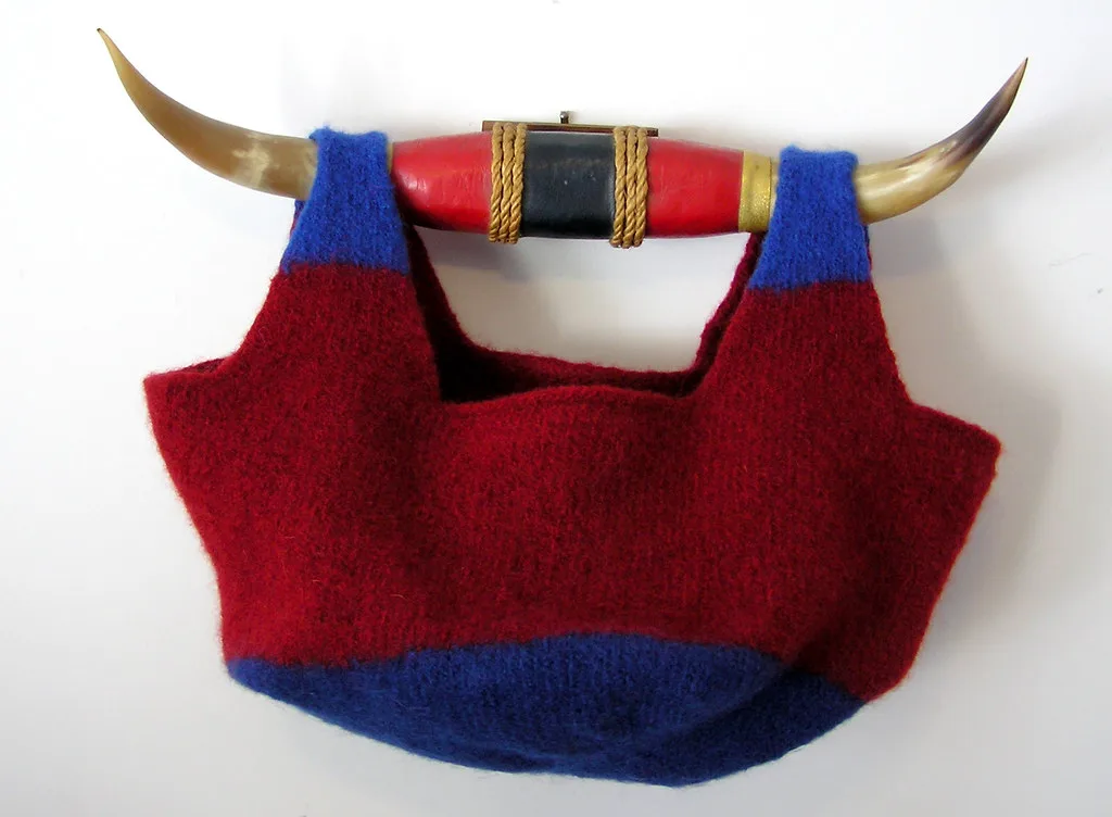 A knitted bag after felting, the stitches shrunk into dense fabric
