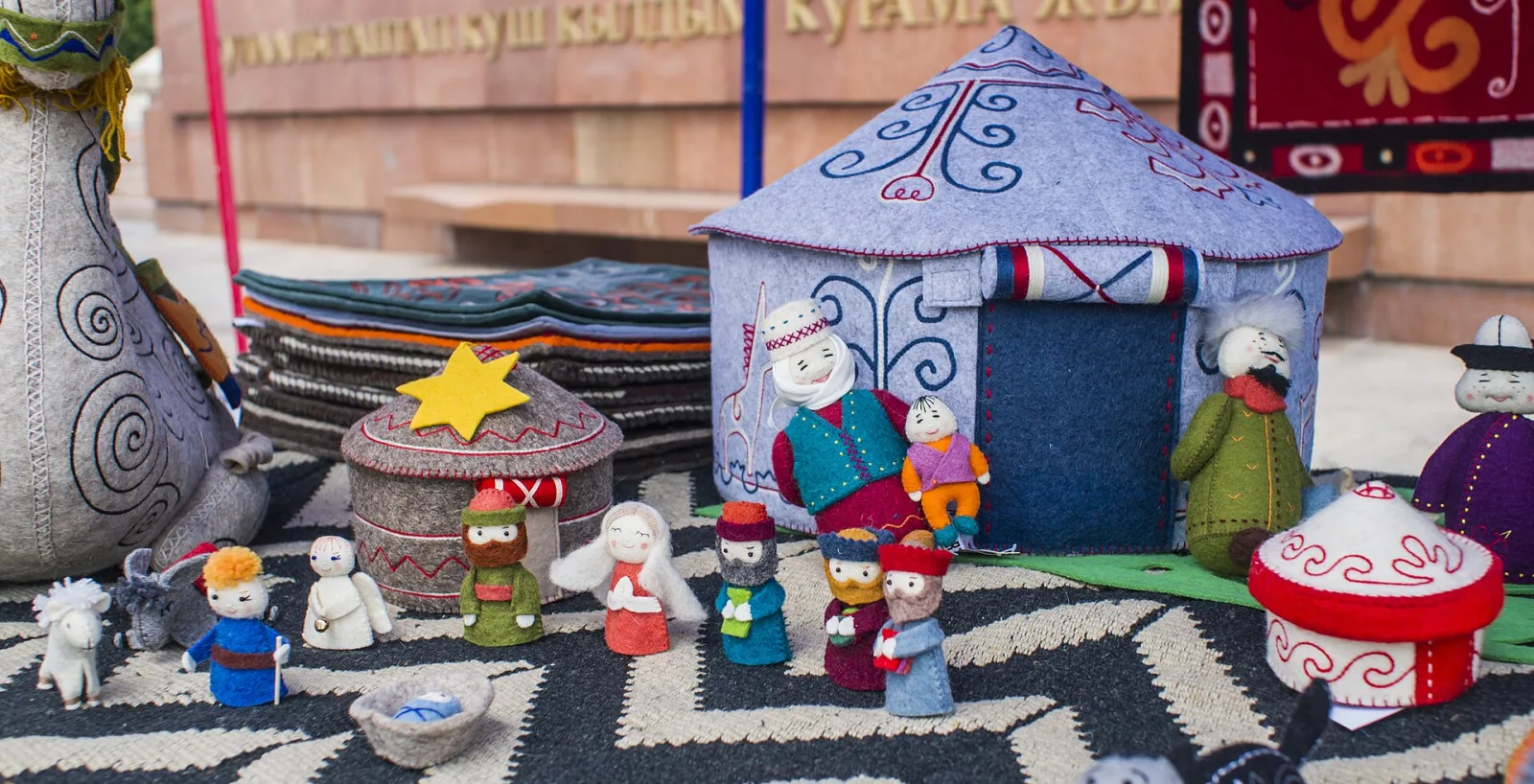 Small felted figures of the kind a project kit is designed to make