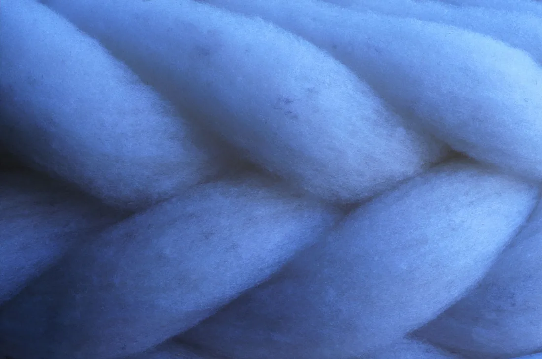 Combed wool drawn into a smooth continuous length