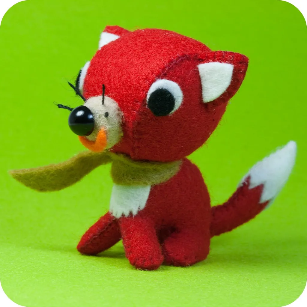 A small felt animal, built the way a felt mouse is