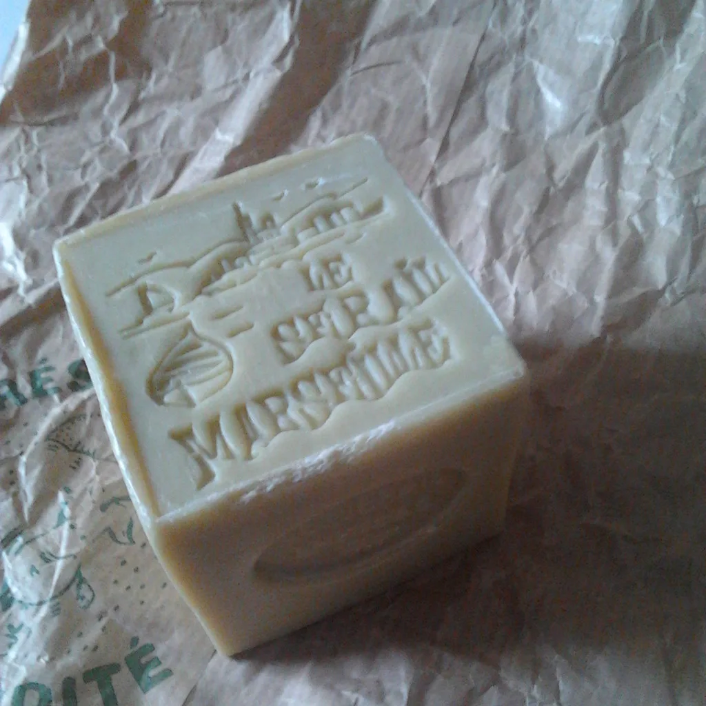 A bar of soap covered in a layer of felted wool