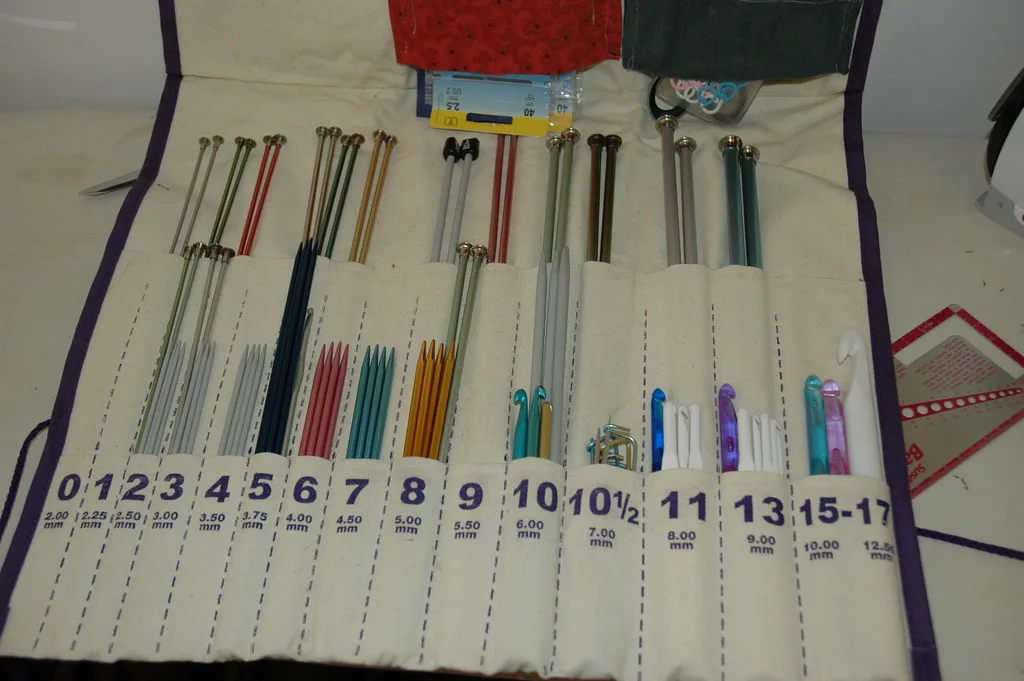 Knitting needles in a case marked with their sizes