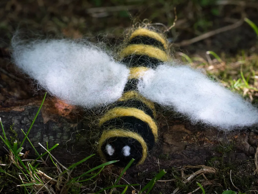 A needle felted bumble bee