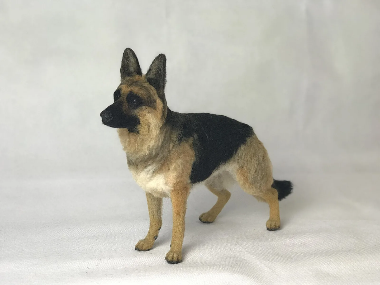 A needle felted german shepherd dog