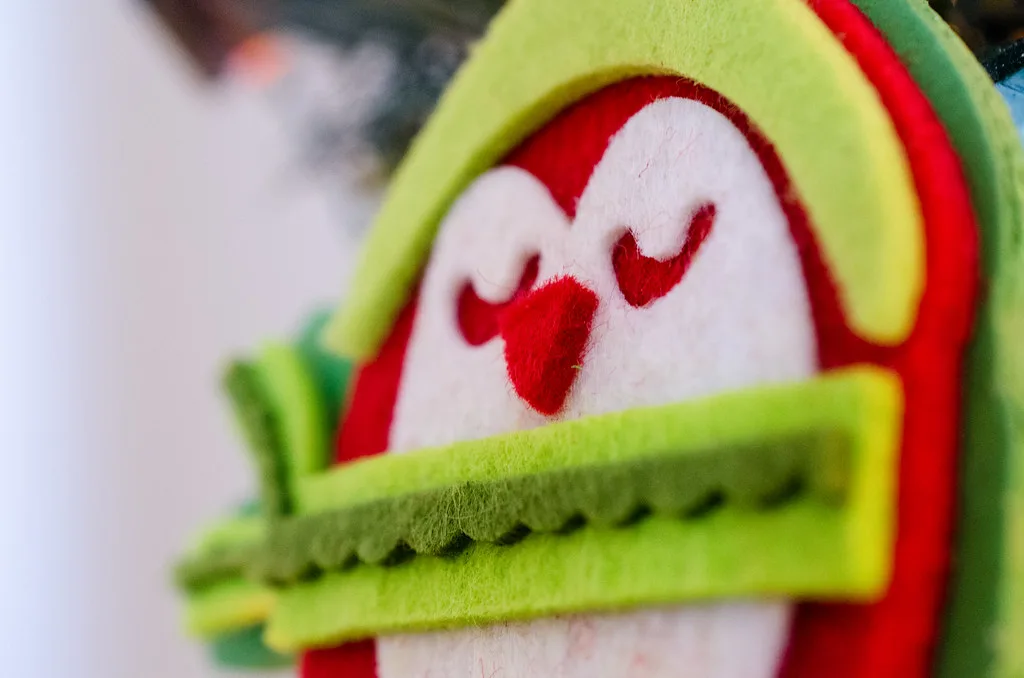 A felted owl ornament