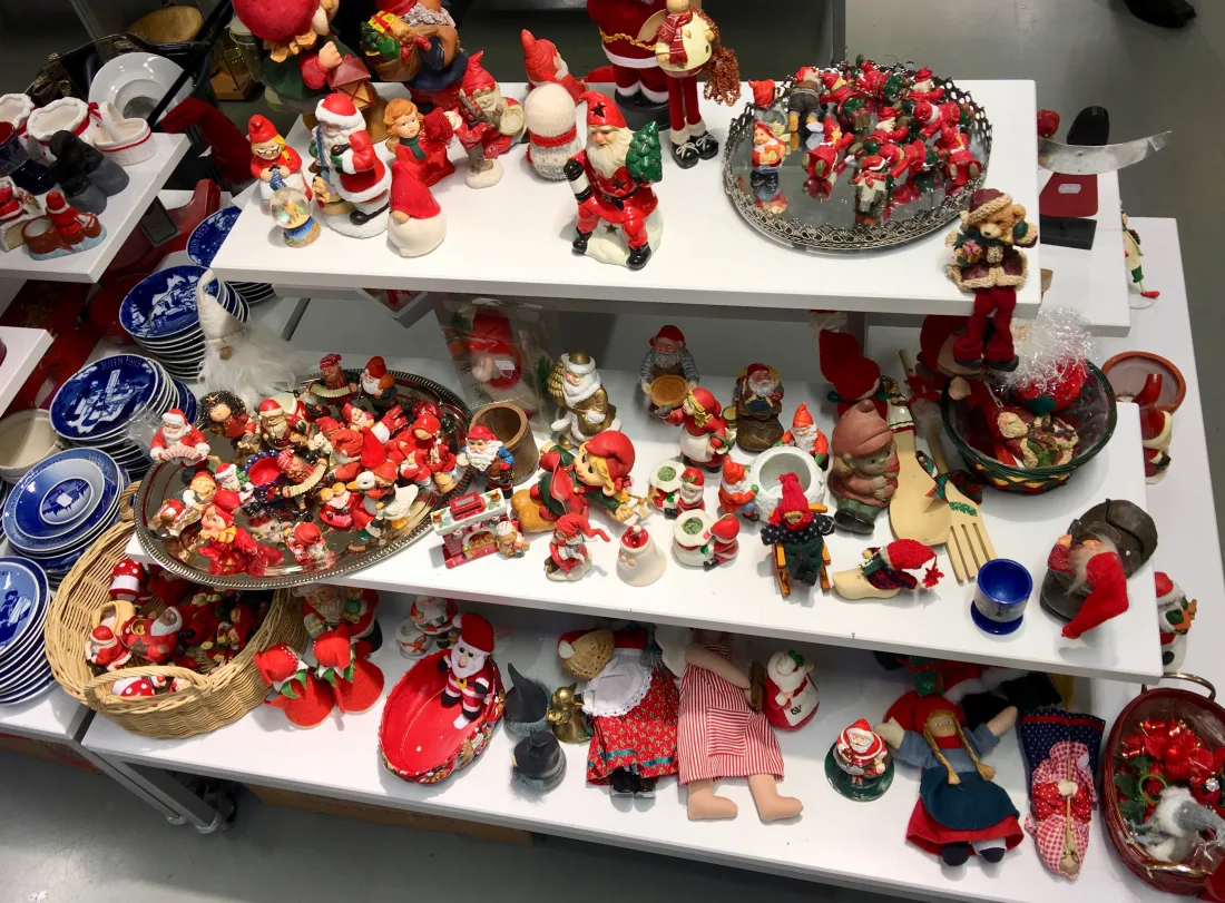 Ceramic Scandinavian tomte and Santa figures on a shelf