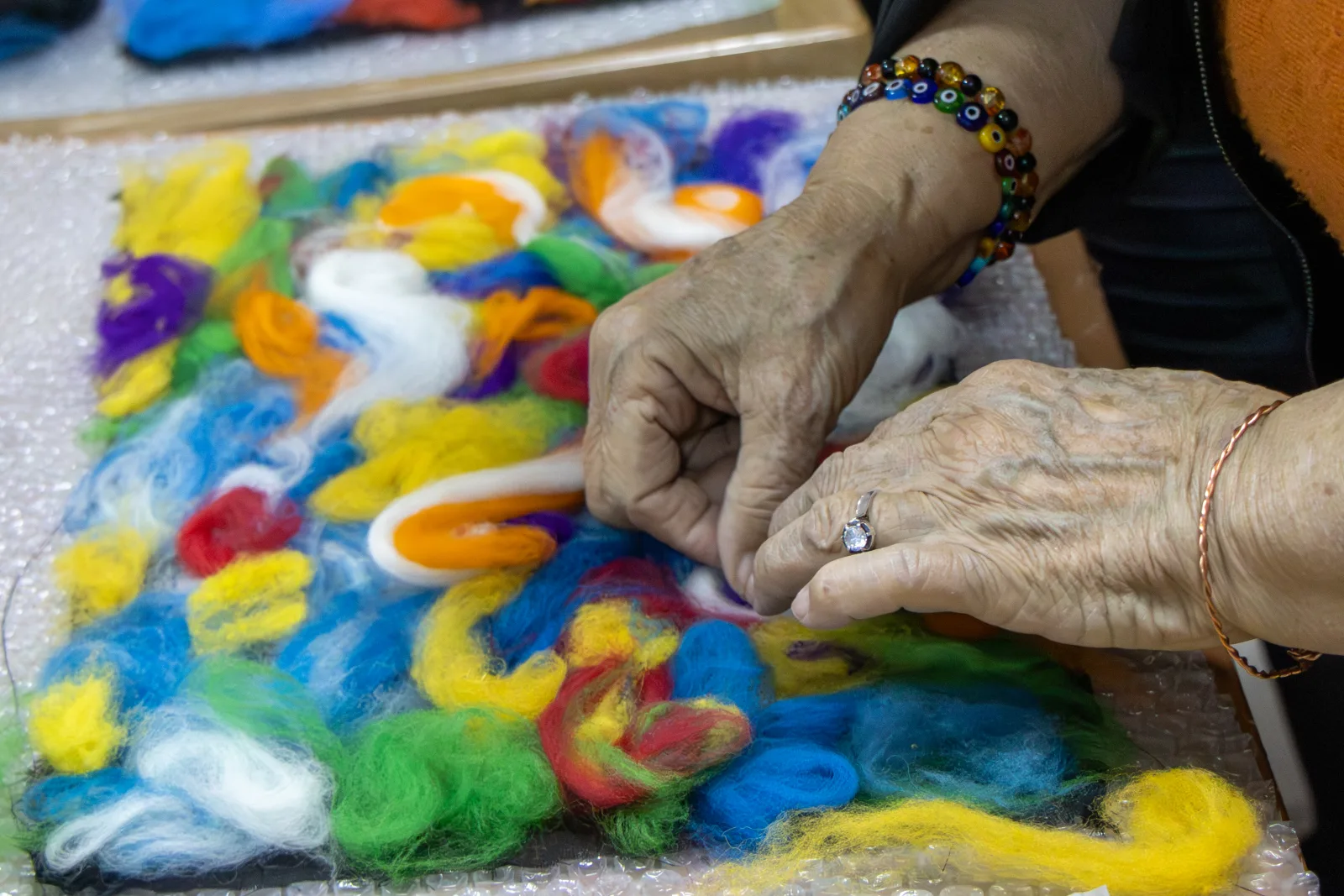 Wet felting in progress at a felt making workshop