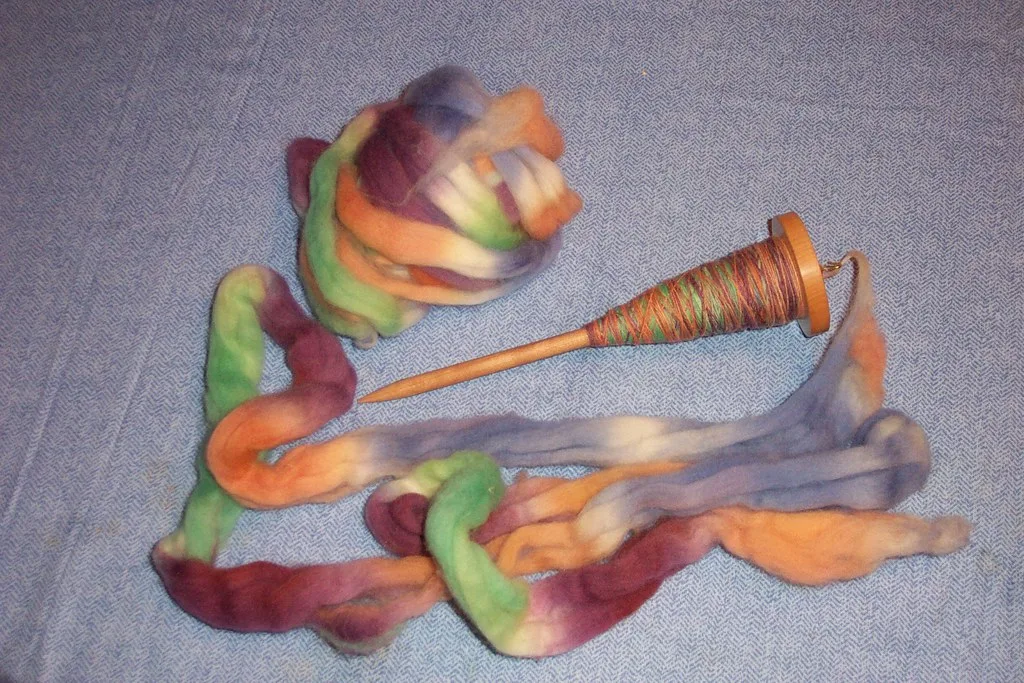 Wool drawn out into a length of fibre