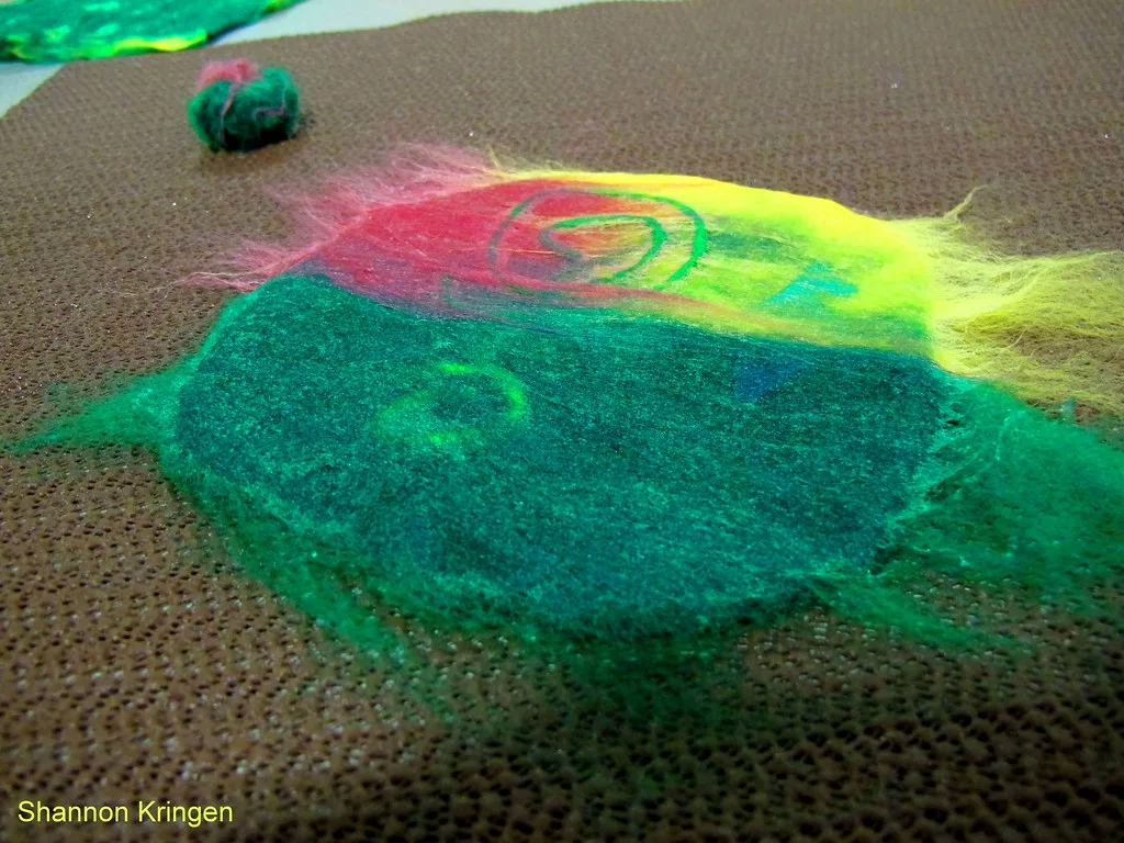 Wet felting in progress, wool soaked with warm soapy water