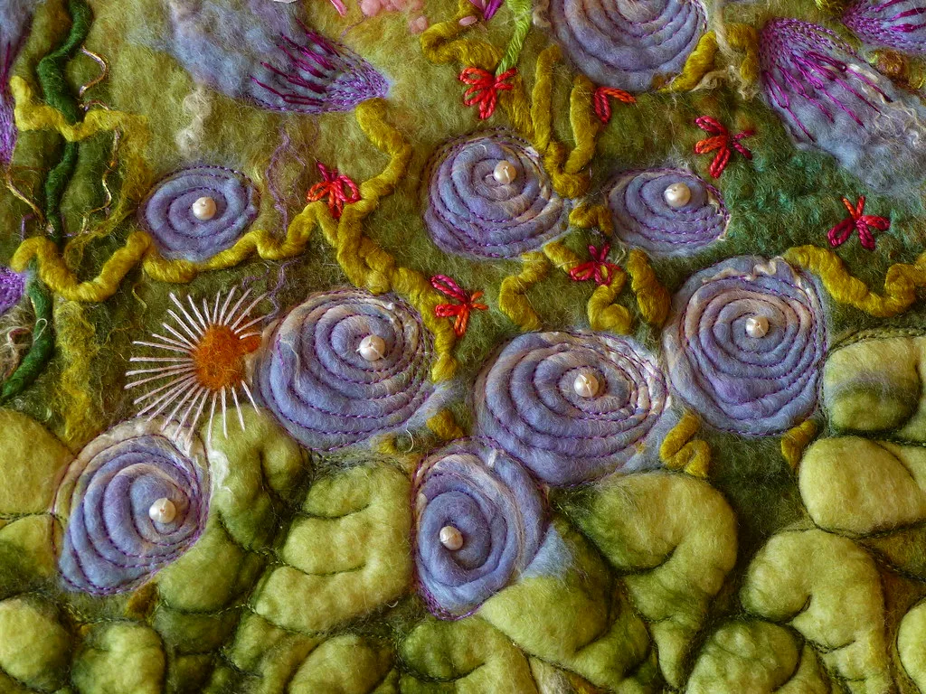 A felted wool picture of flowers